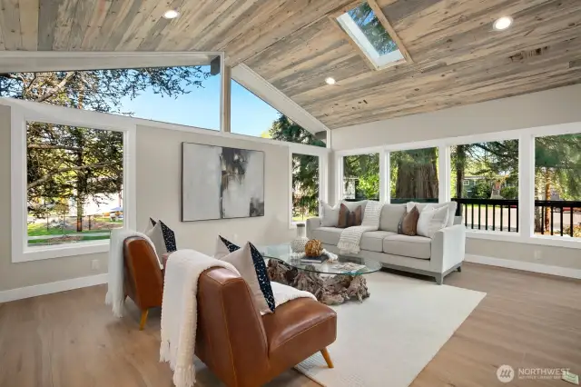 living room with large windows looking onto the new Trex deck