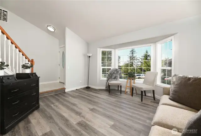 Living room with bayed window.