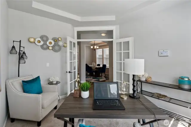 Lots of room for your home office space. French doors look into the entry hall and formal dining room.