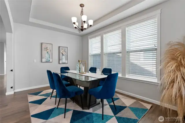 Lovely dining space! Or line the walls with shelves and add a couple of overstuffed chairs for a comfy library/reading nook.