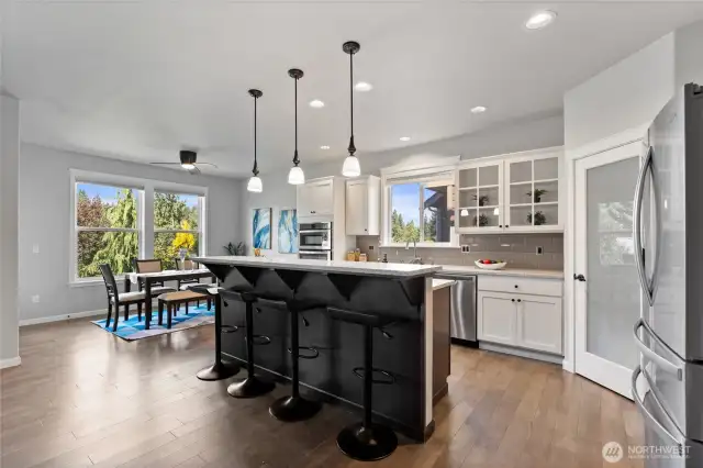 You'll love this kitchen with a walk-in pantry, gas cooktop, breakfast bar and picturesque views!