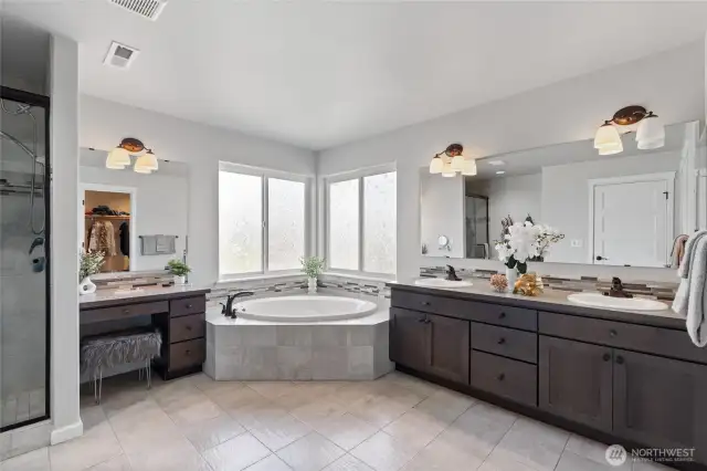 Spacious bathroom with vanity table.