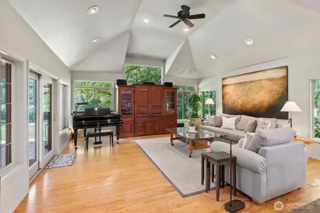 The spacious inviting family room perfectly balances cozy comfort with modern style. The soaring vaulted ceilings, and thoughtfully designed details create an ideal space for relaxing, lively family evenings and entertaining guests.