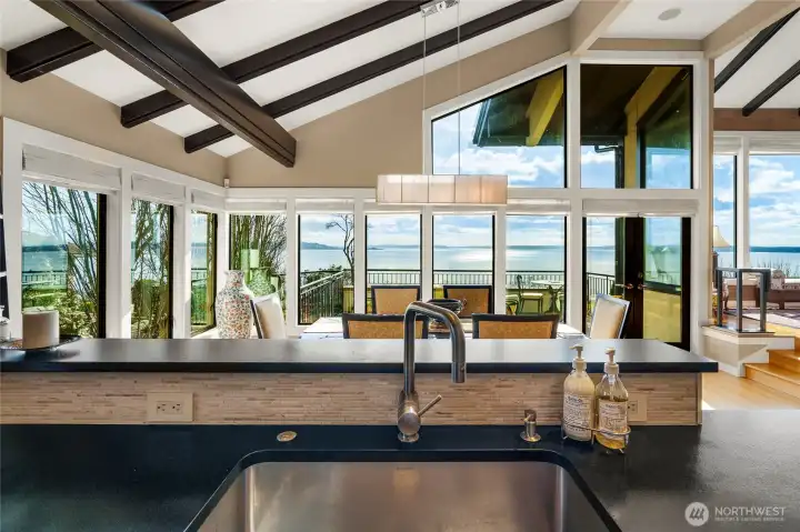 This 180 view spans from Seattle to Mt. Rainier, Alki, the Puget Sound and the Olympic mountains. This is the view from the kitchen sink!  Wonderful place to entertain and enjoy the spectacular beauty- from sunrises to sunsets- the light and the weather is fascinating!