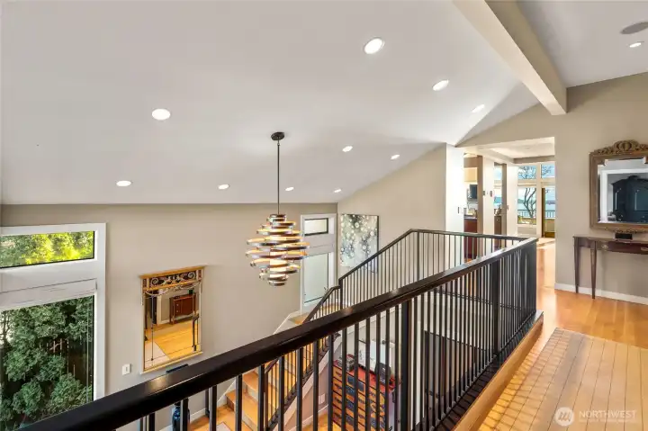 As one leaves the primary suite, you look over the formal entry