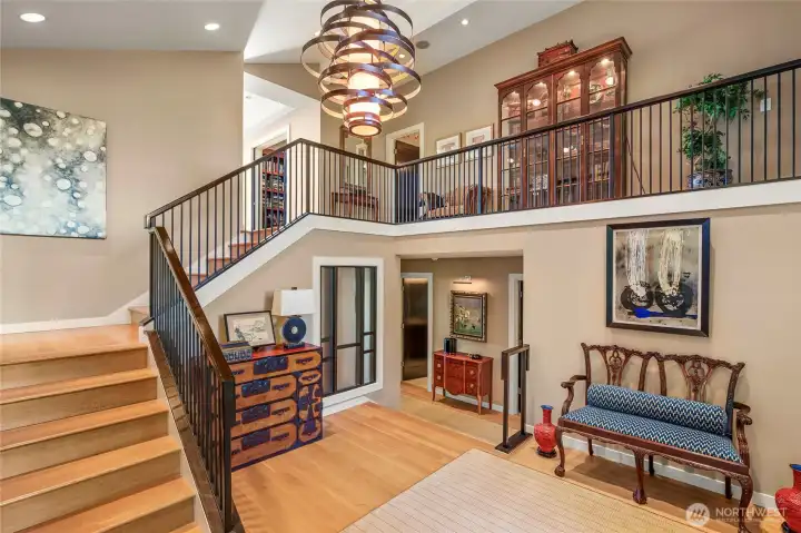 As one enters the main floor of the home, the elegant hardwood staircase, soaring ceilings and beautiful chandelier greet you. The family room and two more bedrooms are down the stairs to the right. The warm palette of this home is a delightful welcome.