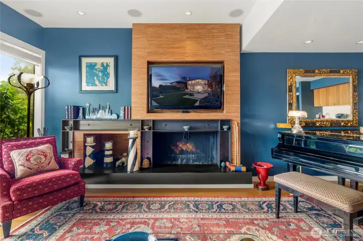The family room has a handsome fireplace which has a gas starter. Great space to relax and watch movies.
