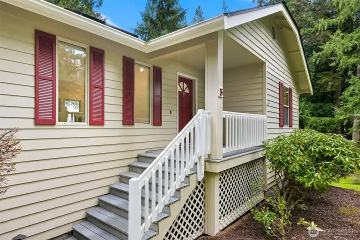 Charming front porch captures all of this home's character.