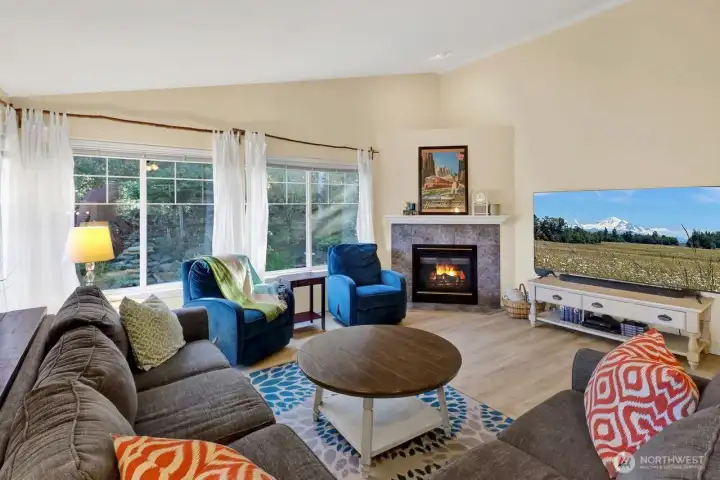 Family room with vaulted  ceilings and gas fireplace.