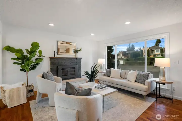 The striking floor-to-ceiling window brings the outdoors in