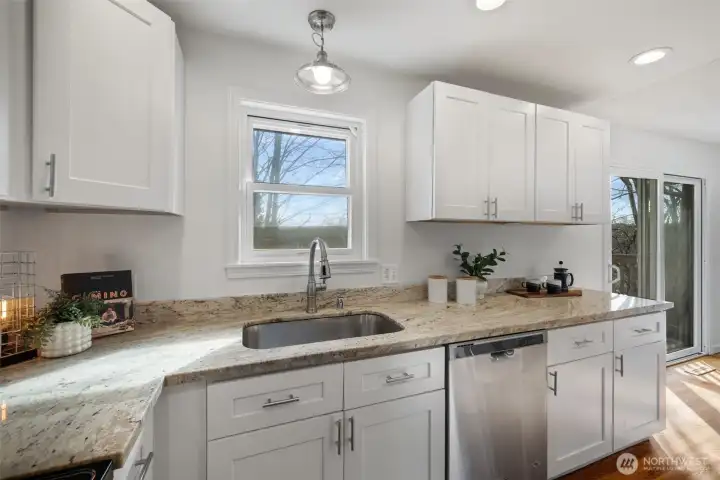 The kitchen has a window overlooking the yard