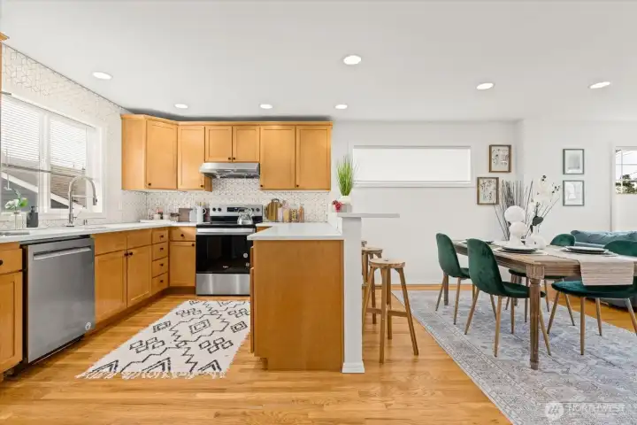 Refreshed kitchen with geometric tile, new countertops, and new hardware.