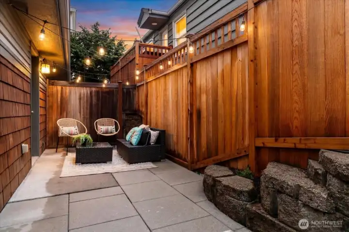 Private, low maintenance patio with brand new, warrantied cedar fence.