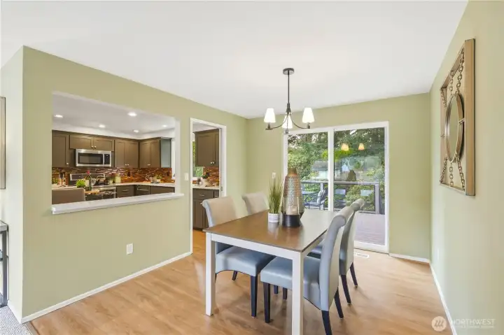Alternate view of the dining room with opening to kitchen.