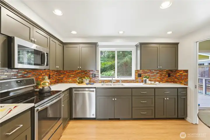Alternate view of kitchen with lots of cabinet space.