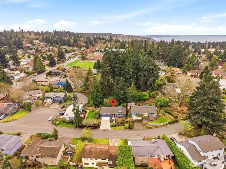 Aerial view showing location of home relative to Syre Elementary, with Puget Sound visible beyond.
