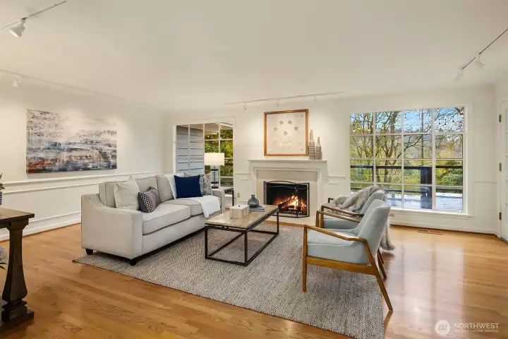 Peaceful forest and Cascade foothill views grace the living room's huge bank of windows.