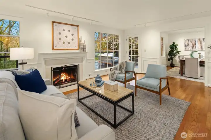 Enjoy the warm gas fireplace, rich hardwood floors, and easy access outside to the exceptional backyard.