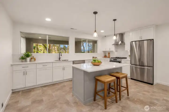*Virtually Staged* This flex space has its own electrical panel and is wired for both an electric range and a dryer. It used to be a kitchen for multi-generational living!