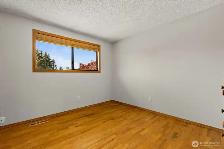 Upper-level bedroom 3, currently empty