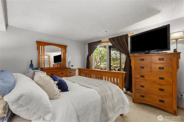 A glass slider opens to the backyard.