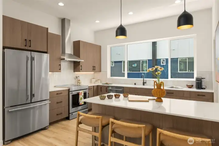 Seated peninsula for a quick bite or conversations with the chef! Photo is of model home of same floorplan. Color schemes and finishes will vary per plan. Seated peninsula for a quick bite or conversations with the chef! Photo is of model home of same floorplan. Color schemes and finishes will vary per plan.