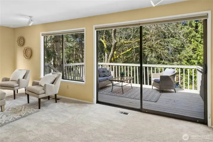 Slider from the family room leads out to the sunny back deck.