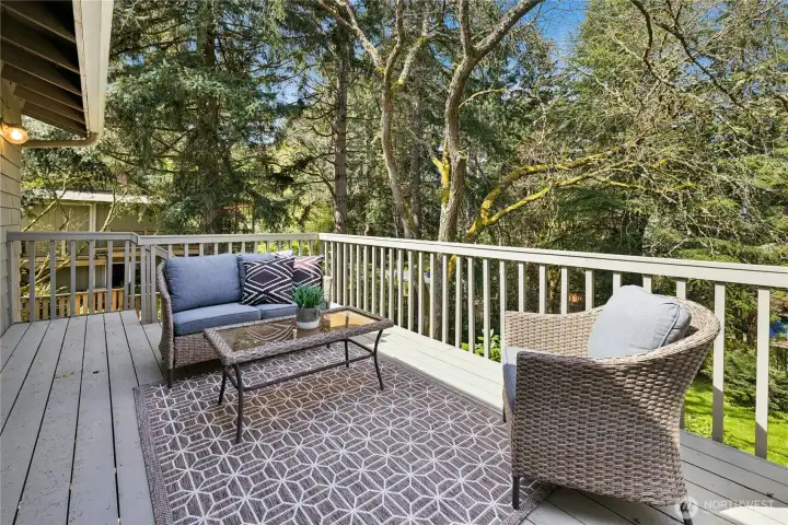 The deck has stairs down to the backyard.