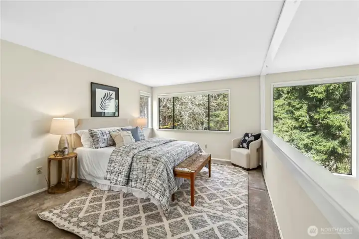 Upstairs is the light and airy primary bedroom suite.