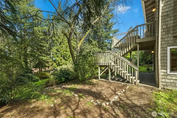 The stairs from the upstairs deck down to the backyard.