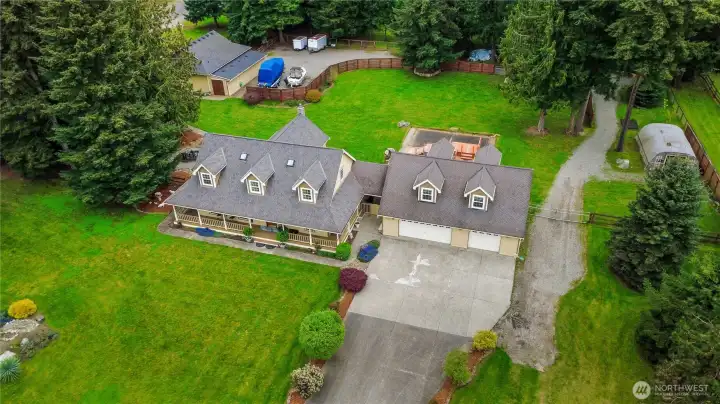 2.31 Acres, Corner lot.  6 car garage spaces    Overhead photo showing this well designed property