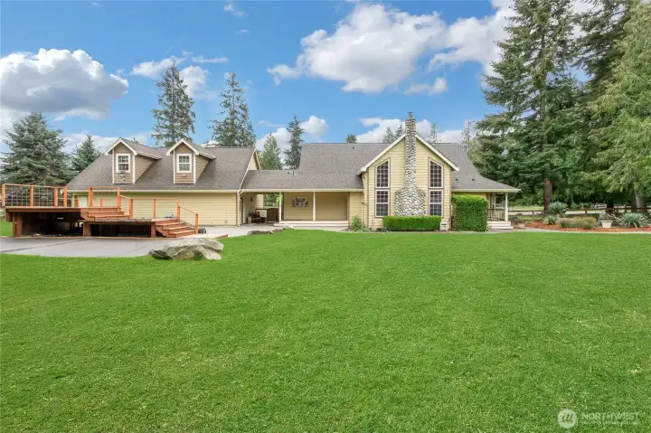 Back yard. The deck is custom built and was used for an above ground pool and hot tub.  Both have been removed but the deck is so well built that it’s ready for your next adventure.