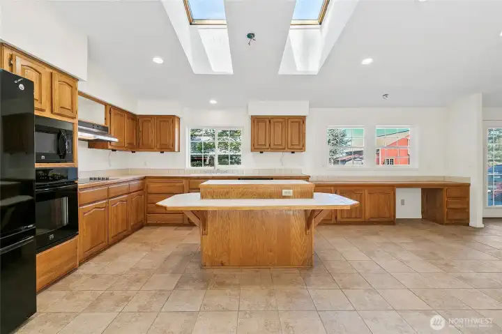 Spacious kitchen with plenty of cabinets.