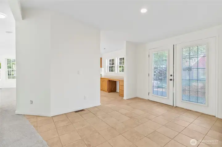 French doors off dining room leading out to back patio.