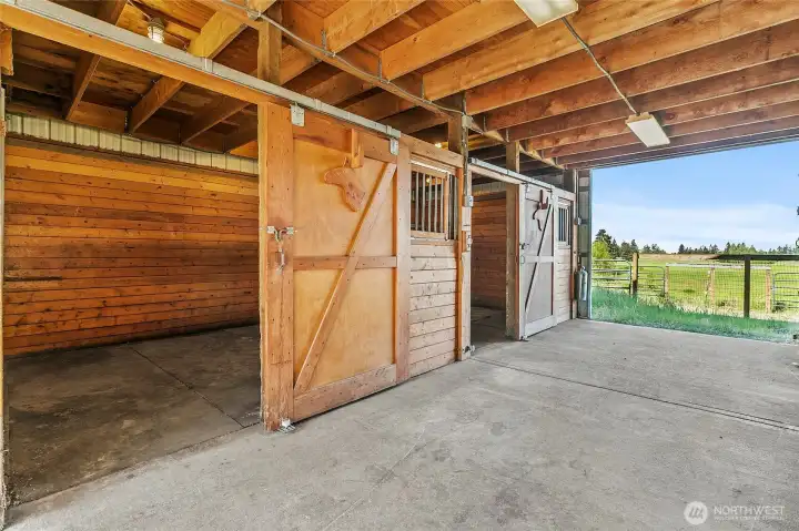 Barn with 4 stalls and plenty of hay storage in the loft.