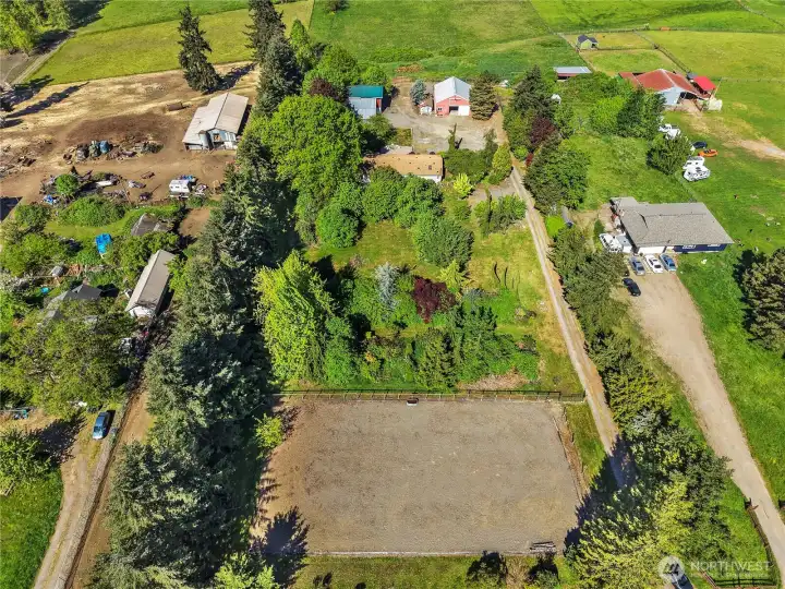 Looking from road barn on right and RV garage with blue roof on left.
