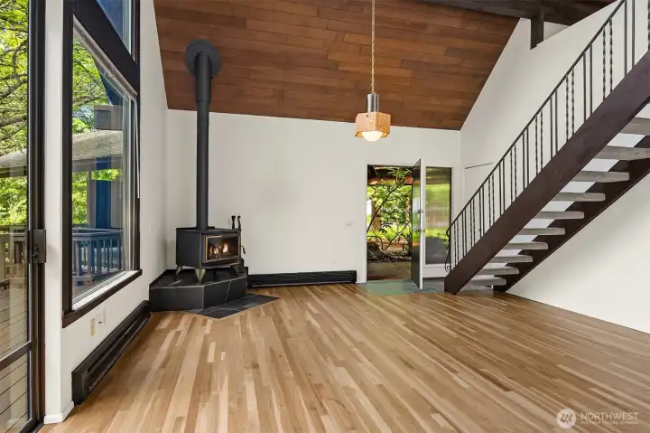 Looking back from dining area to entry and stairs up to primary suite.