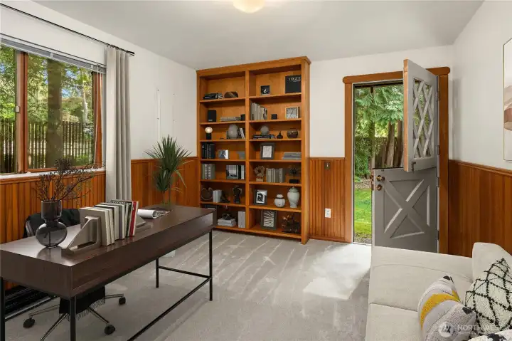 (Virtually Staged) Main level office/bedroom with built-in bookcases and Dutch door to backyard.