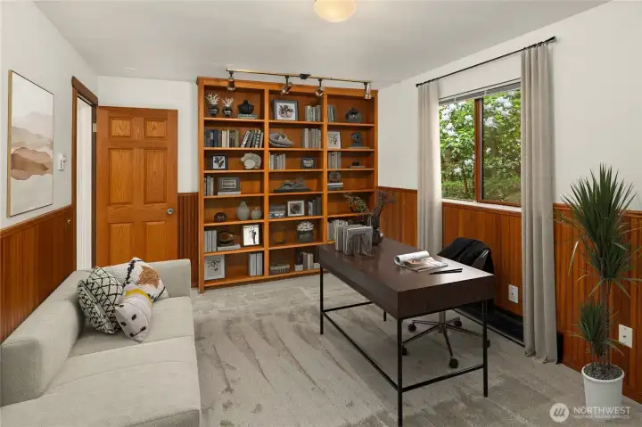 (Virtually Staged) Main level office/bedroom with built-in bookcases. Door to hall.