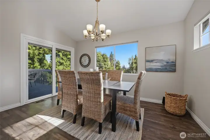 Large dining room with sliders that lead out onto the deck and view of the backyard. Large dining room with sliders that lead out onto the deck and view of the backyard.
