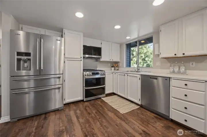 Kitchen features stainless steel appliances and plenty of storage space. Kitchen features stainless steel appliances and plenty of storage space.