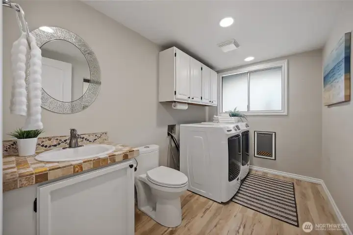 Lower level utility room with 1/2 bath. Lower level utility room with 1/2 bath.