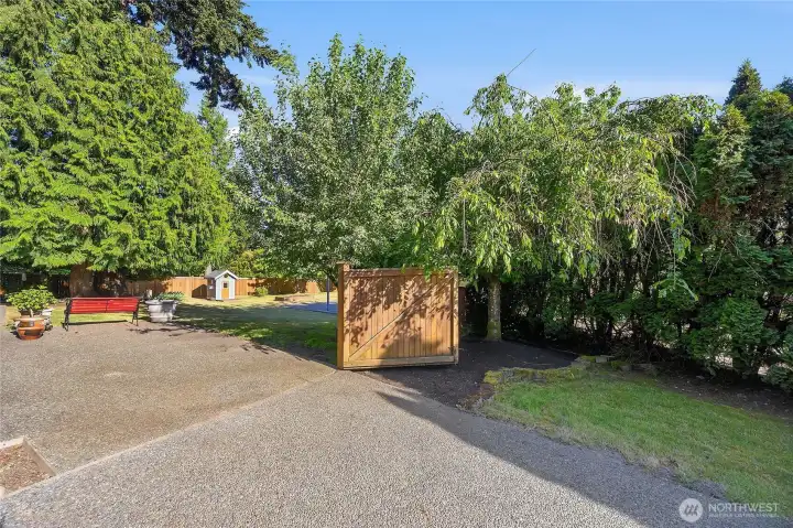 The side gate from the driveway opens up onto the backyard. Parking for your RV or Boat is no problem. The side gate from the driveway opens up onto the backyard. Parking for your RV or Boat is no problem.