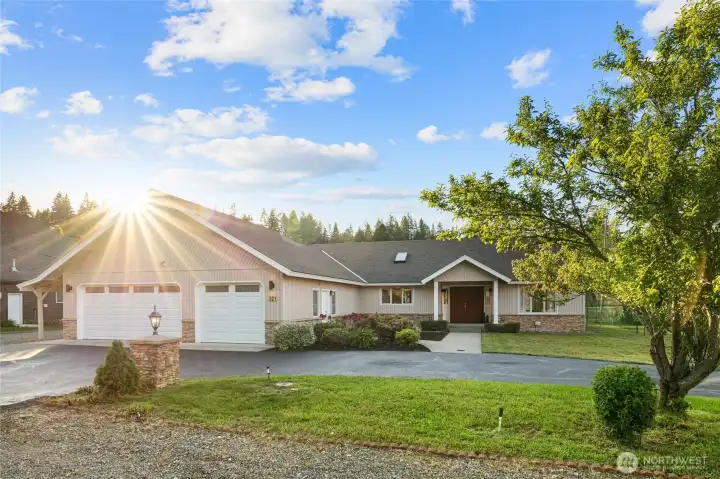 The recently sealed driveway offers a fresh, well-maintained welcome