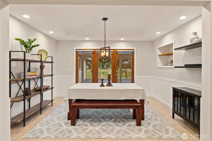 Light and bright dining room with seamless access to the large deck.