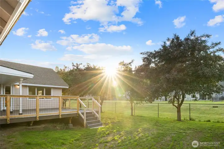 With plenty of room to play, this expansive and fenced yard is perfect for cornhole tournaments, cartwheels, backyard games, and pets to enjoy.