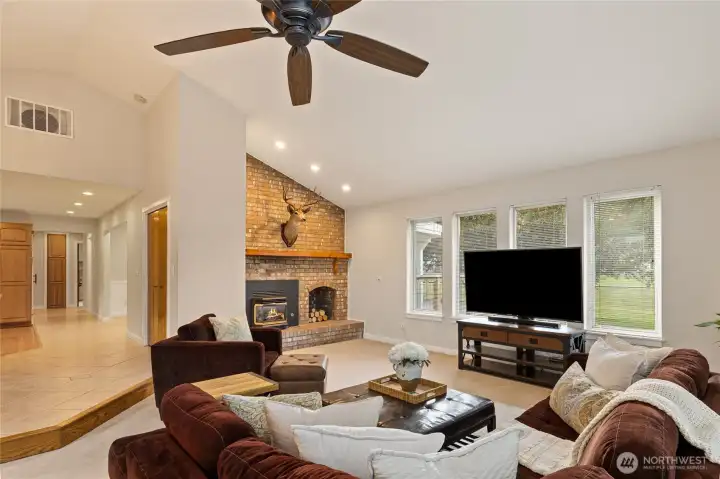 Open, airy, and inviting, the living room is filled with natural light from expansive windows that beautifully frame golf course and territorial views.