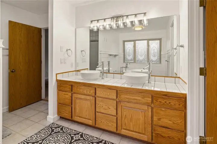 Dual vanities provide ample space and storage.