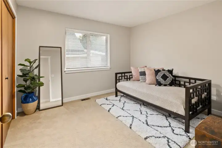 The third bedroom offers comfortable accommodations for guests, hobbies, or a home office.