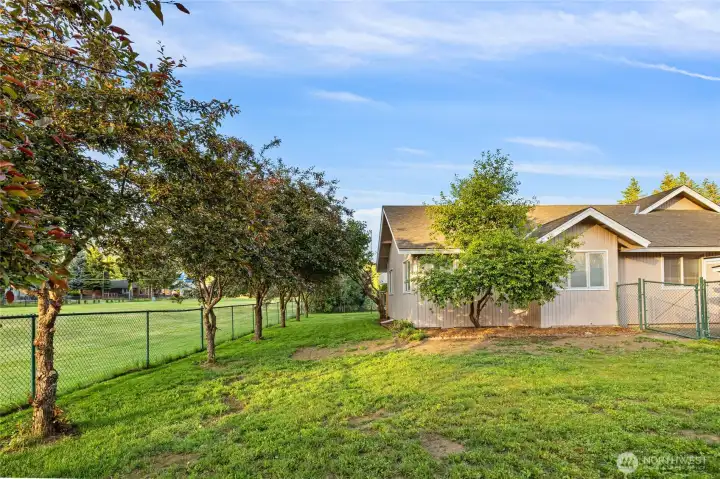 Another view showcasing the mature trees, peaceful setting, and beautiful golf course views.